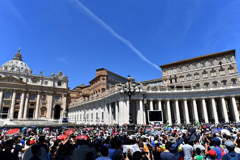 Pope Francis addresses the crowd from the window of the apostolic palace overlooking St Peter's square during his Angelus prayer on June 17, 2018 at the Vatican.